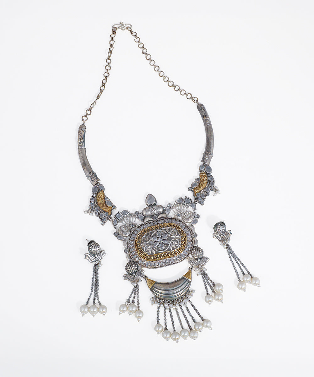 Silver-tone and gold-tone necklace set with intricate floral motifs and faux pearl drops