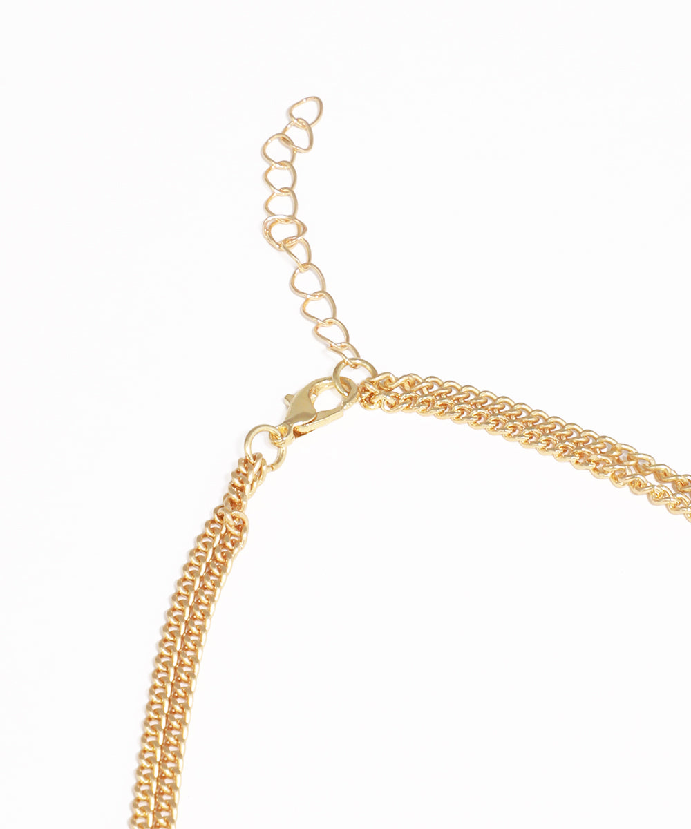 Gold chain necklace on a white background