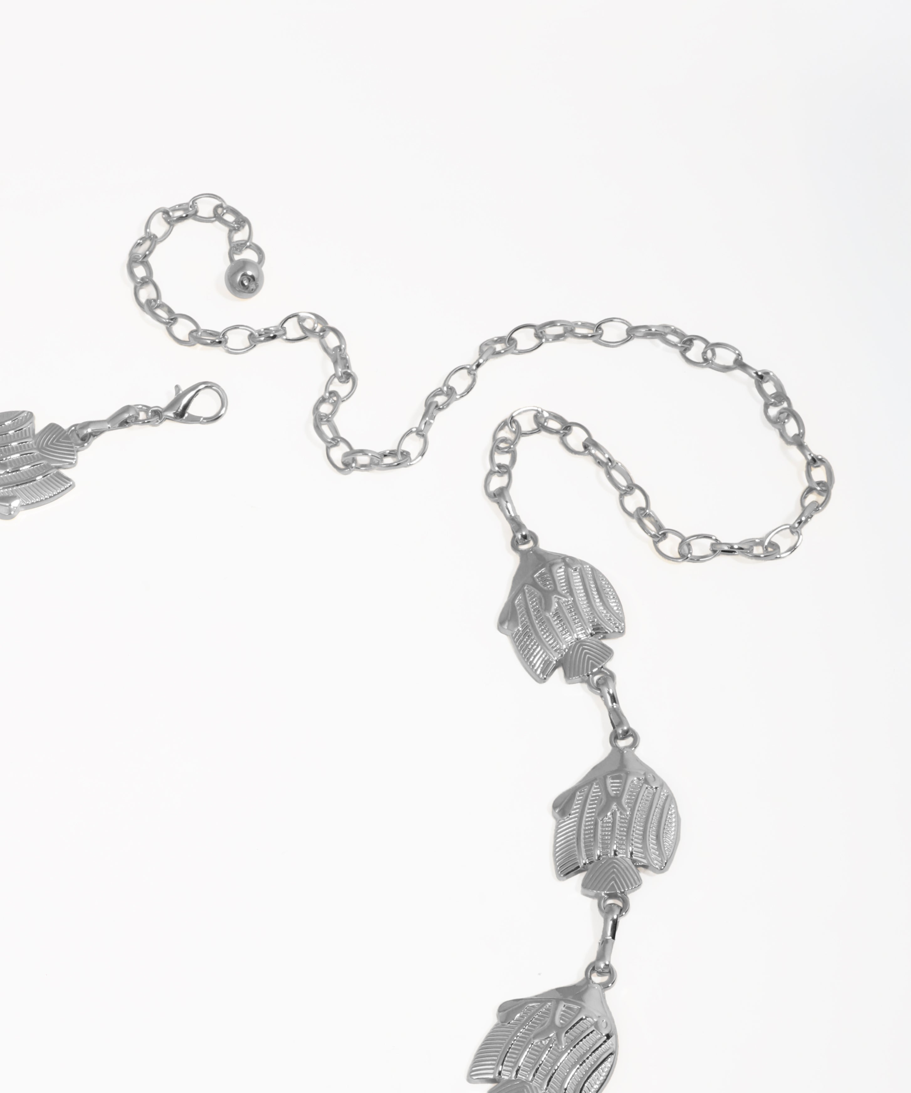 Silver bracelet with leaf-shaped charms on a white background