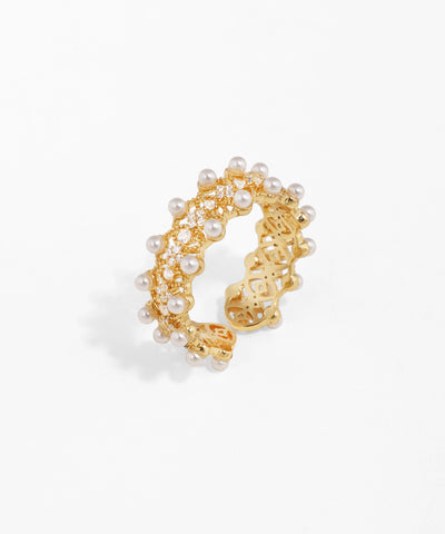 Gold-tone open ring with white faux pearls and clear CZ stones on an intricate band design.
