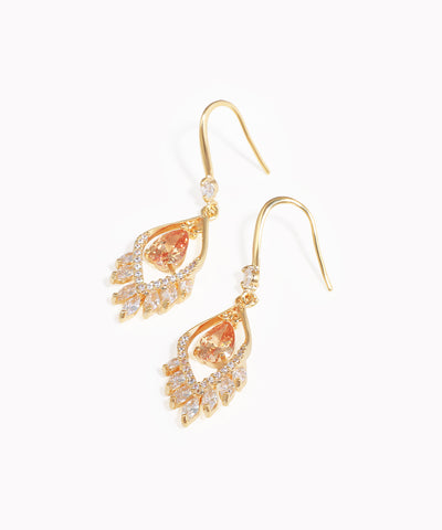 Gold-tone drop earrings with pear-shaped peach stone and marquise-cut CZ accents