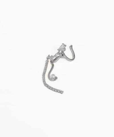 Silver earring with intricate design on a white background