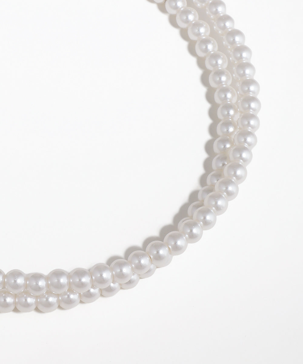 Pearl necklace on a white background