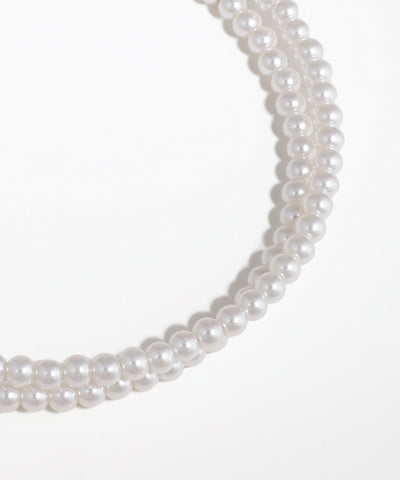 Pearl necklace on a white background