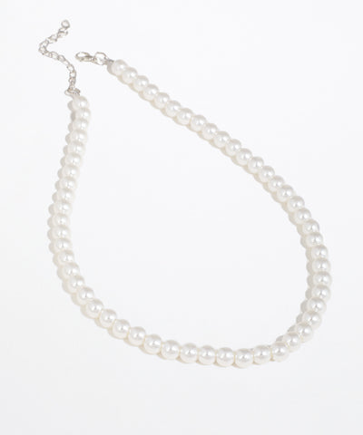 Silver-tone necklace with uniform white round beads and an adjustable chain clasp.