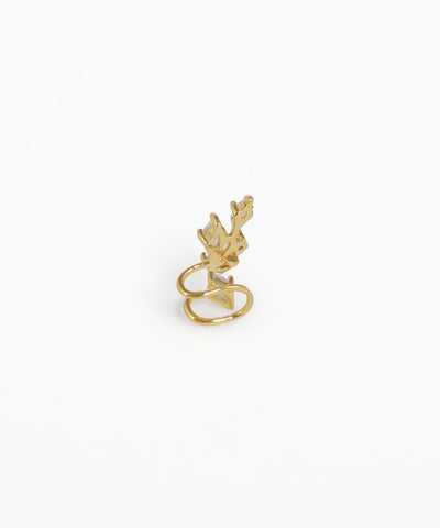 Gold ring with a small bird design on a white background