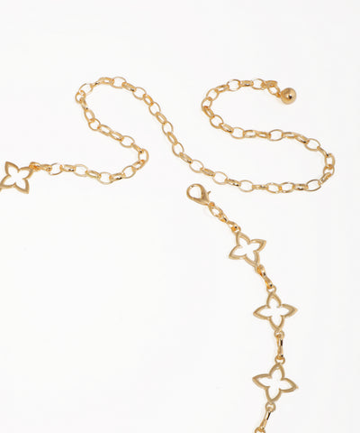 Gold chain necklace with butterfly designs on a white background