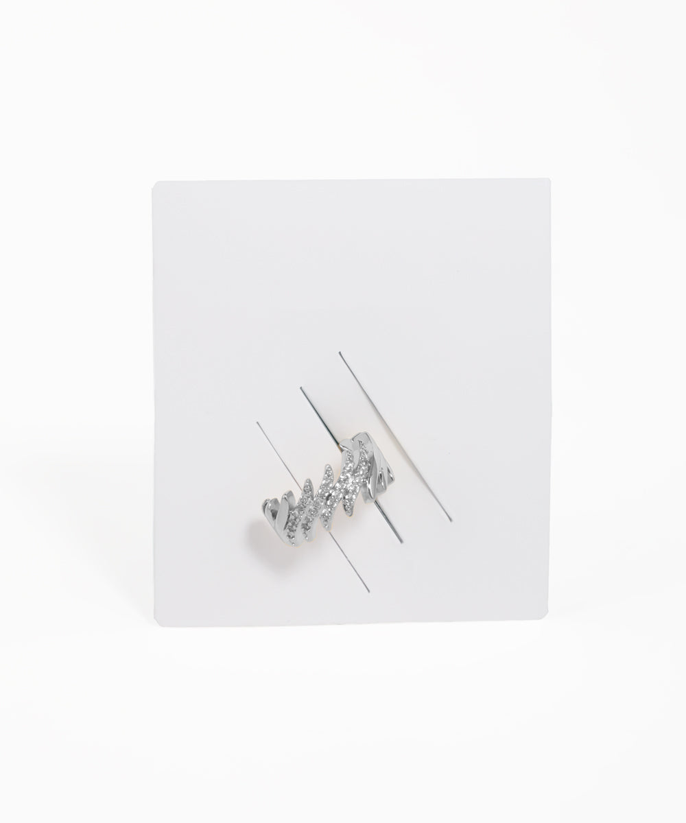 Silver hair clip with clear stones on a white background