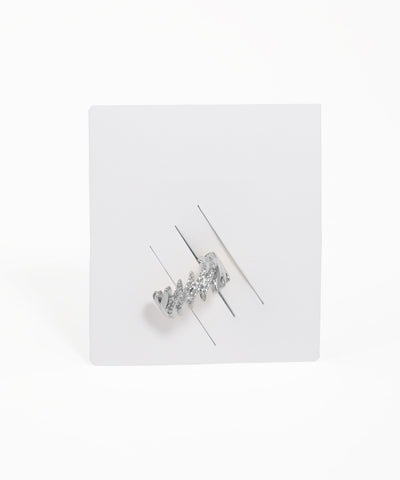 Silver hair clip with clear stones on a white background