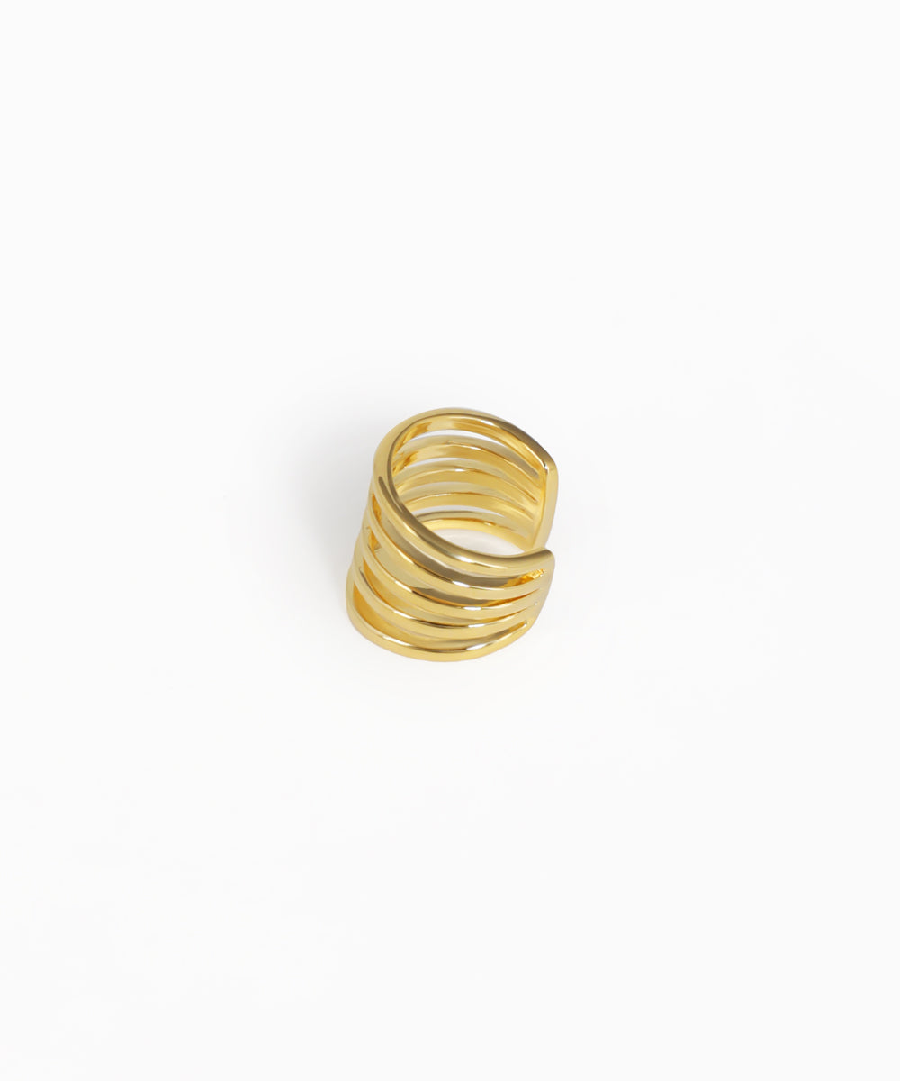 Gold spiral ring on a white background