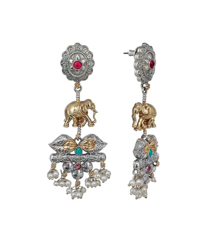 Ornate earrings with elephants and gemstones on a white background