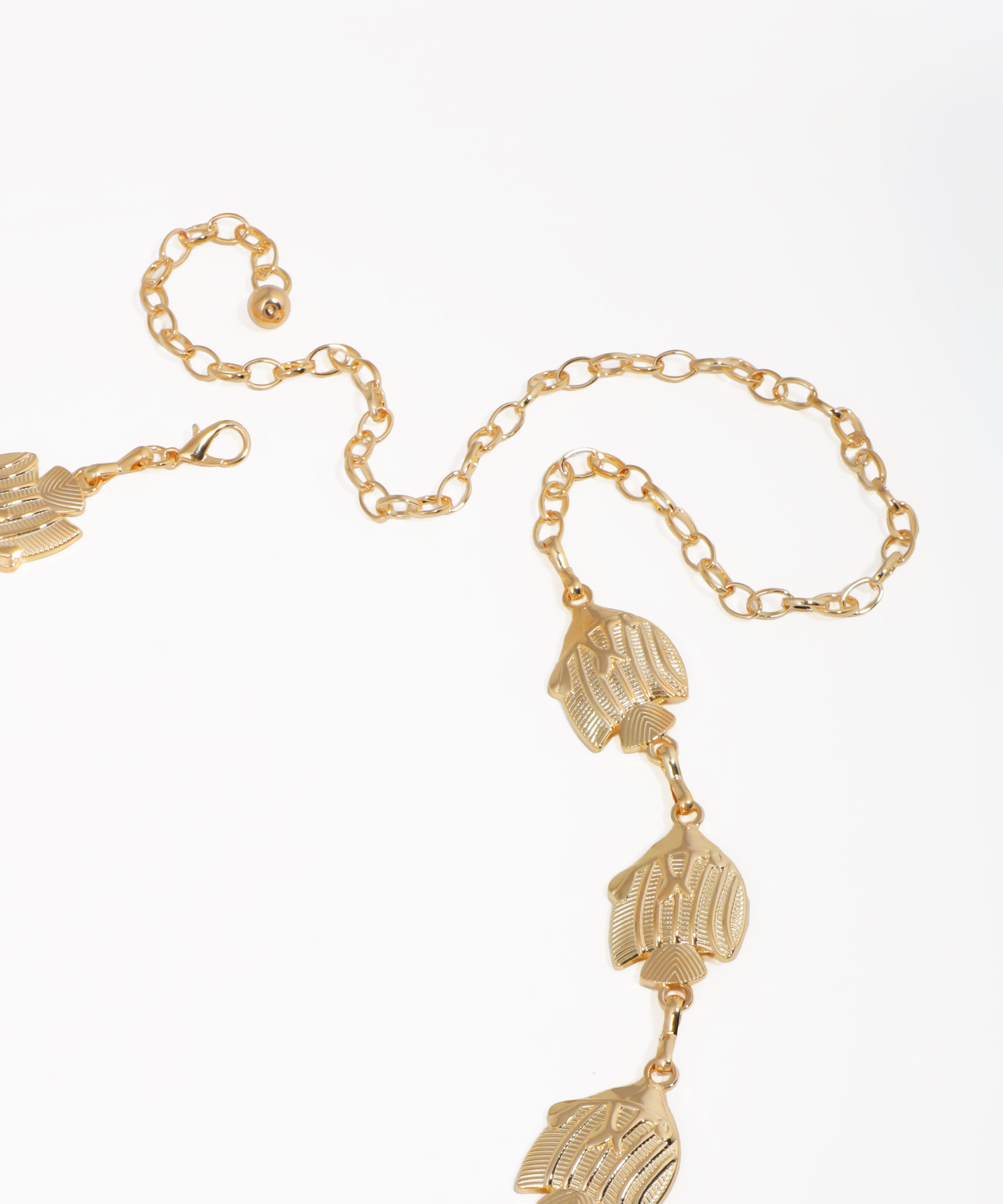 Gold bracelet with hand-shaped charms on a white background