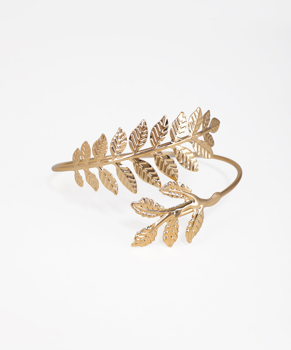 Gold leaf-shaped bracelet on a white background