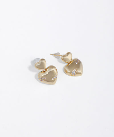 Gold-tone heart drop earrings with small clusters of clear stones on the larger heart element.