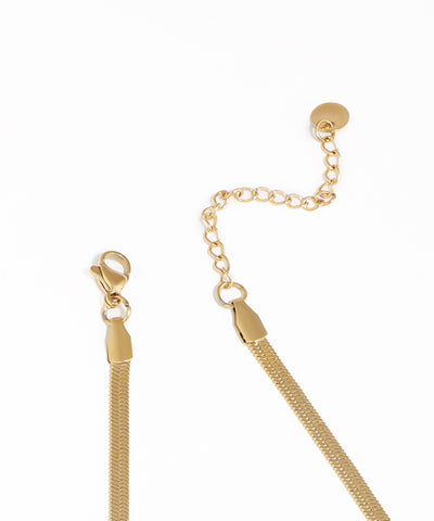 Gold chain with clasp on a white background