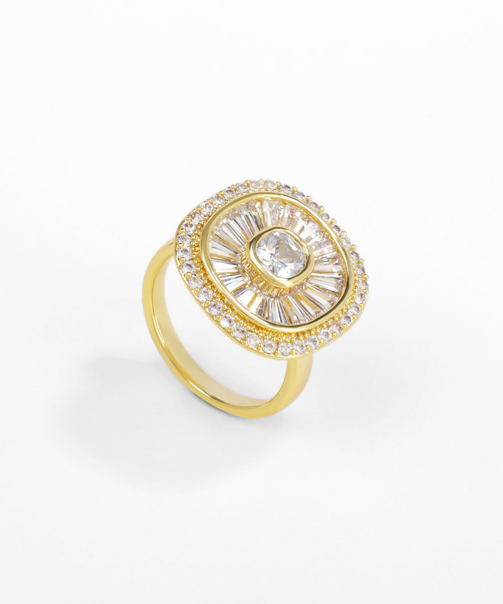 Gold ring with a central diamond and smaller stones on a white background