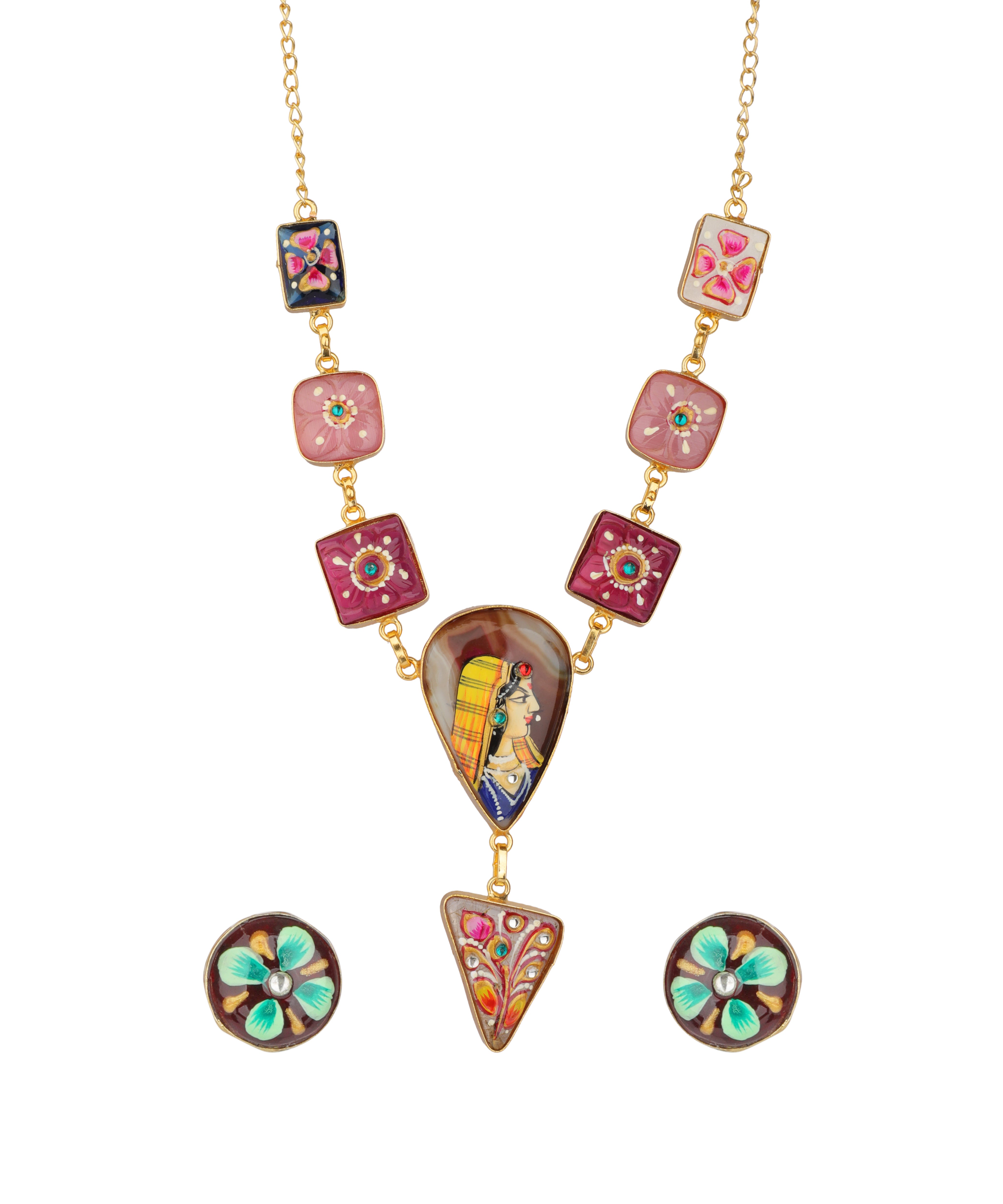 A gold-tone necklace set with a long chain featuring colorful hand-painted glass tiles, a large teardrop pendant with an illustrated figure, a small triangular pendant, and two matching round stud earrings on a plain white background.