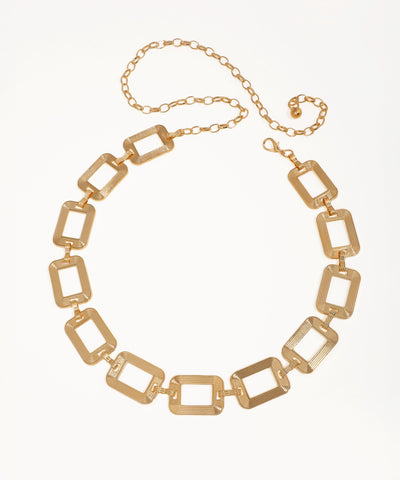 Gold chain necklace on a white background