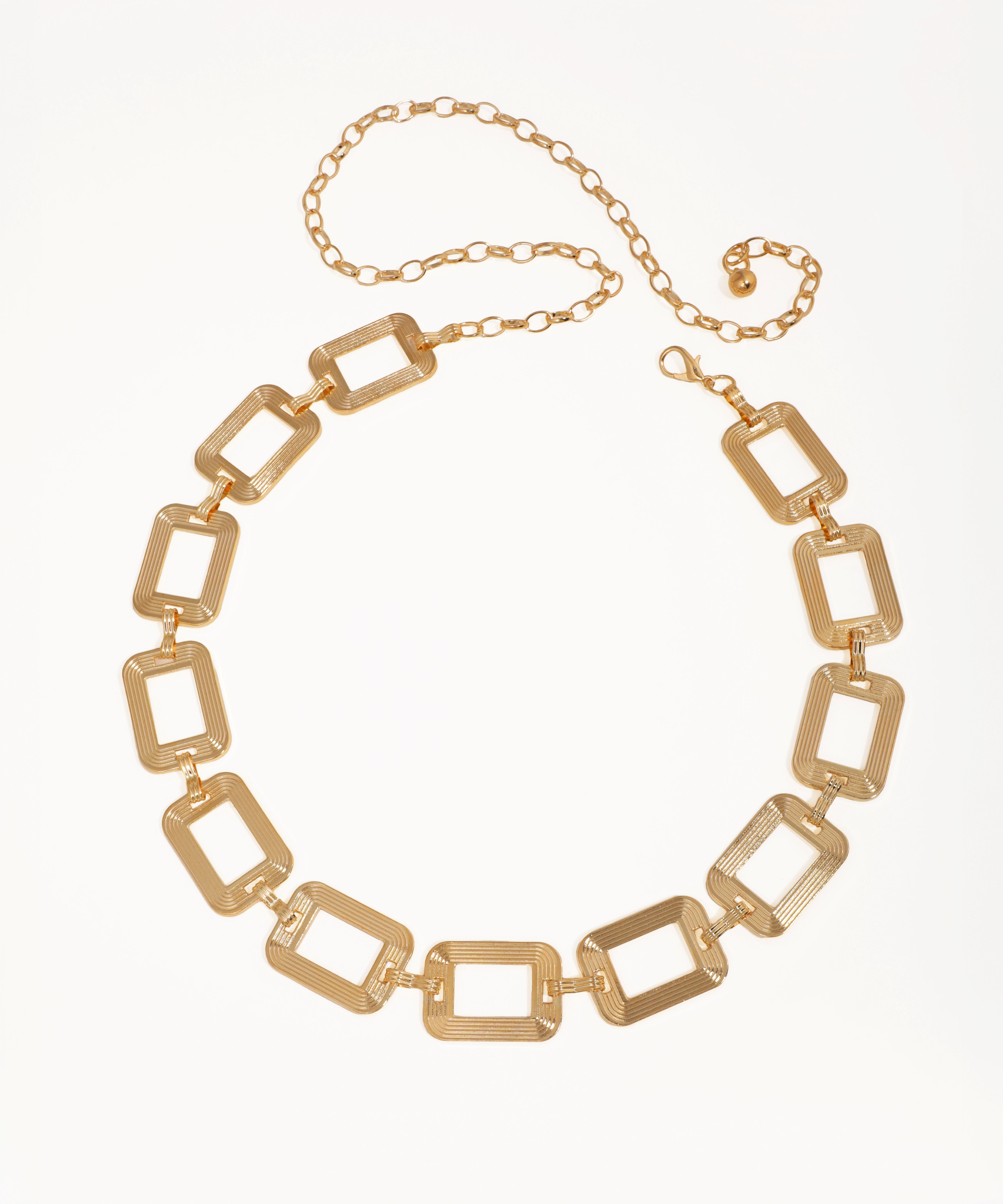 Gold chain necklace on a white background