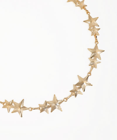 Gold star-shaped necklace on a white background