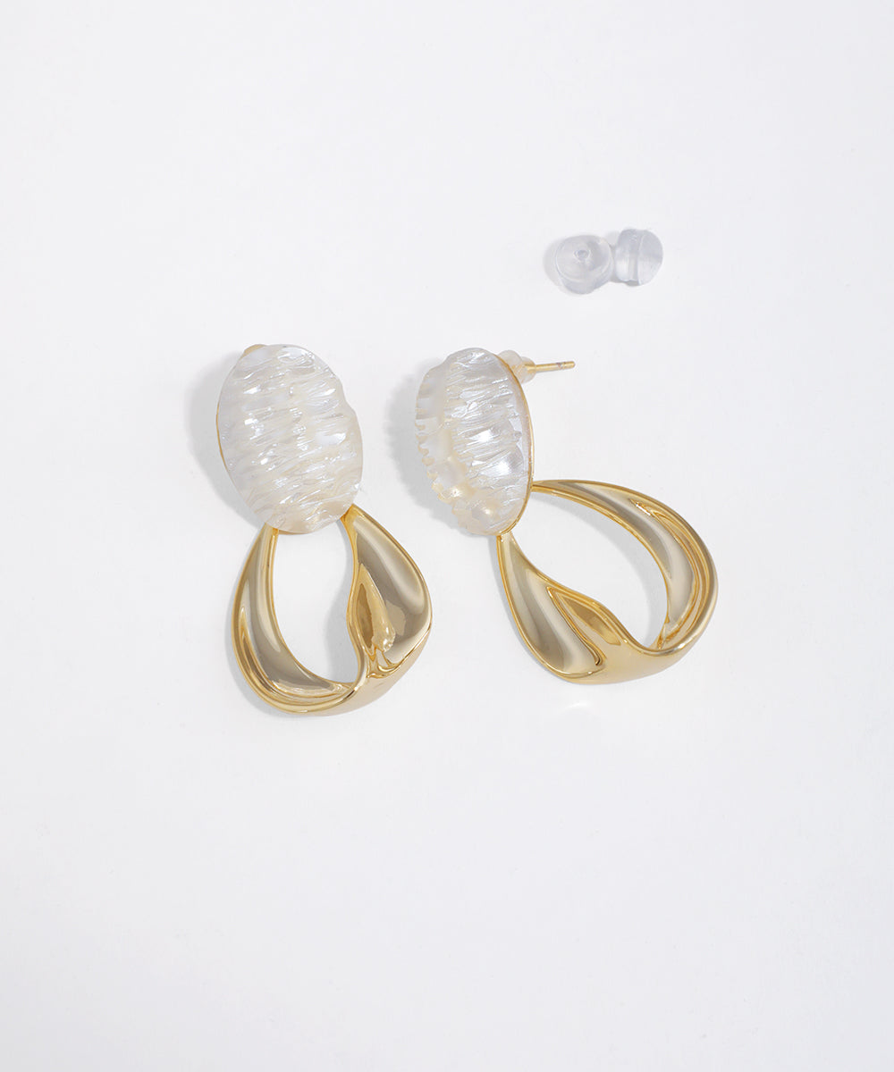 Gold-tone drop earrings with iridescent oval top and twisted metal loop design