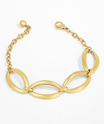 Gold bracelet with interlocking loops on a white background
