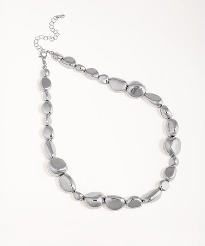 Rhodium finish necklace with polished irregular shaped links and an extender chain