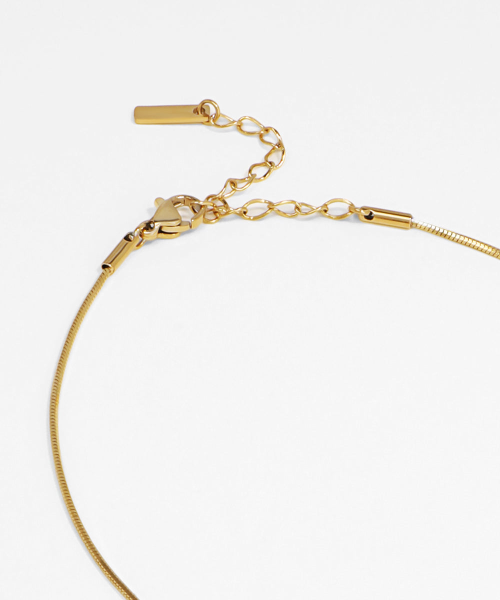 Gold bracelet on a white background