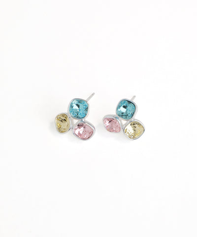 Pair of earrings with multicolored gemstones on a white background