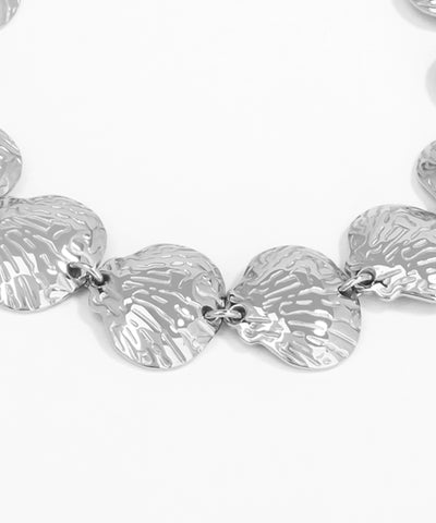 Silver leaf-shaped necklace on a white background