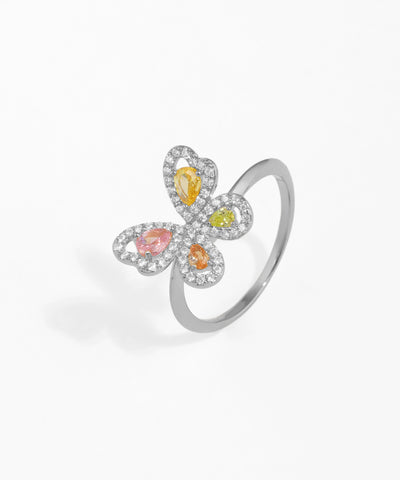 Silver ring with colorful gemstones on a white background