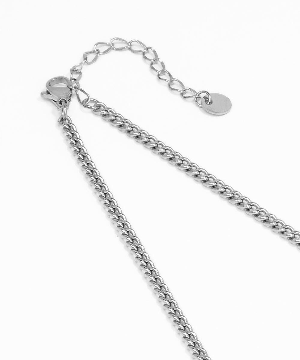Silver chain necklace on a white background