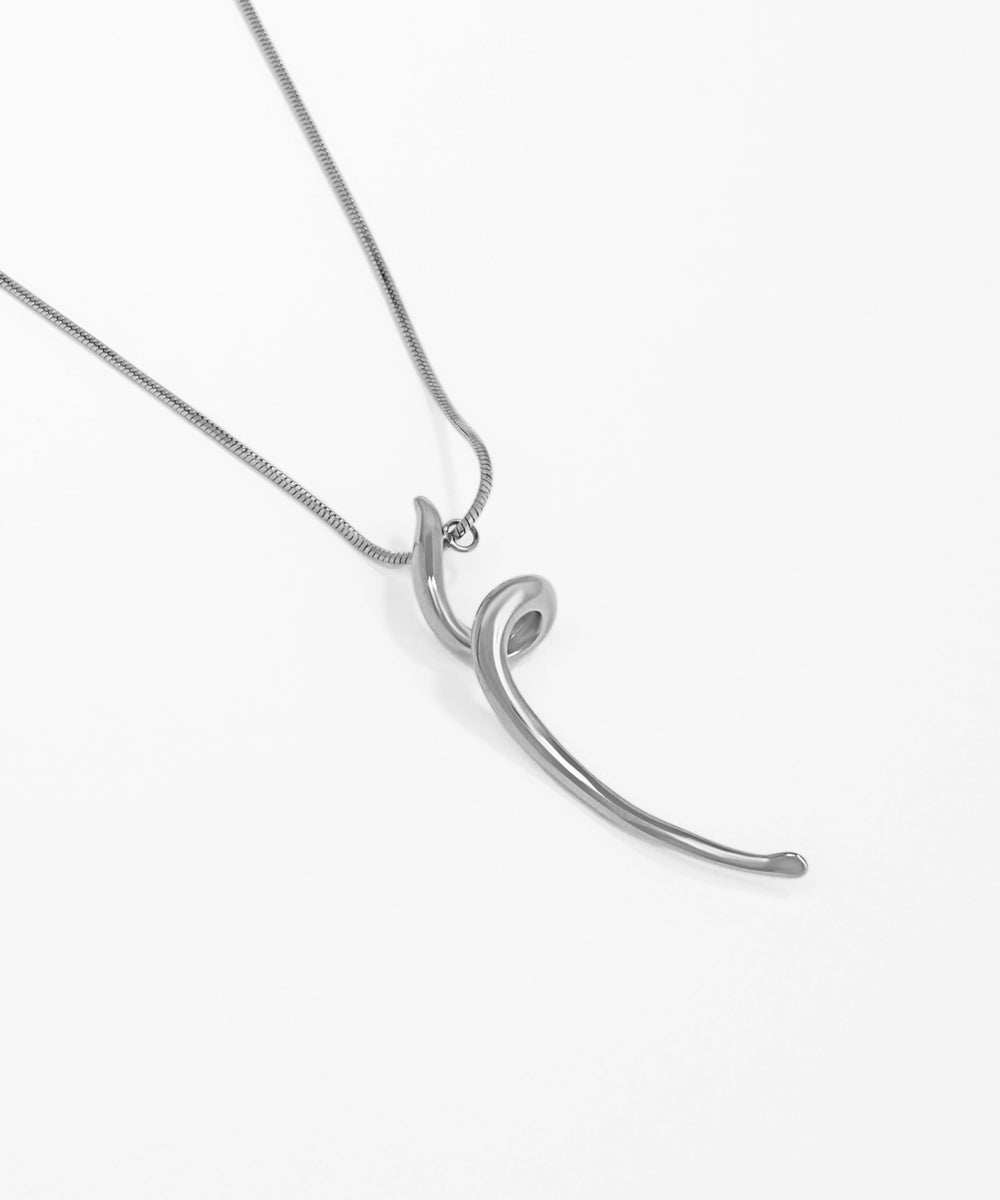 Silver necklace with a unique pendant on a white background