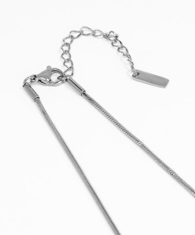 Silver chain necklace on a white background