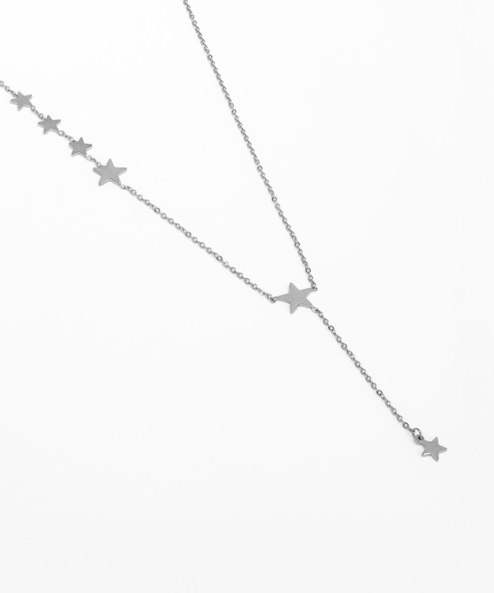 Silver star necklace on a white background