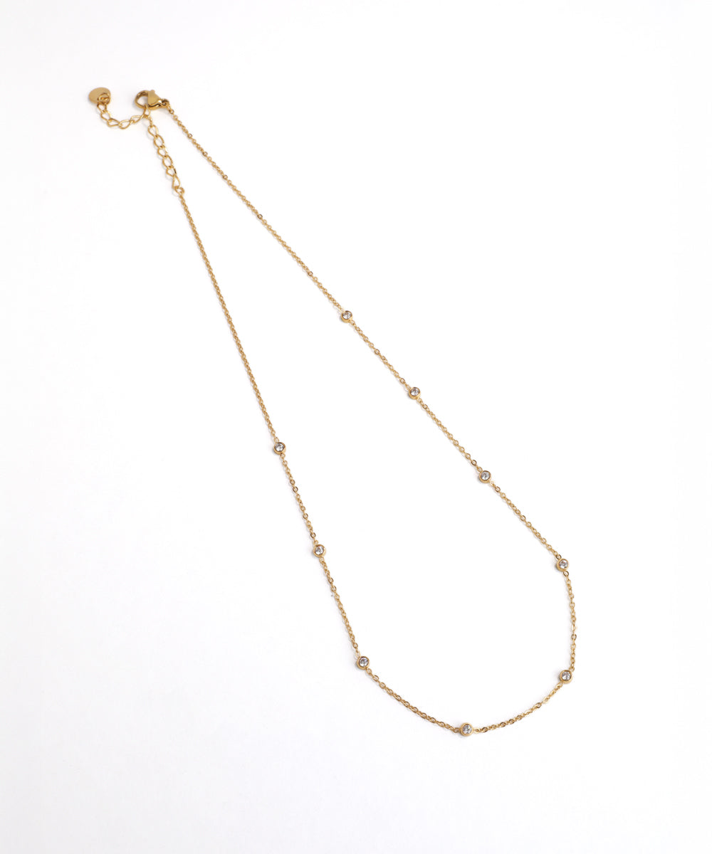 Gold necklace on a white background