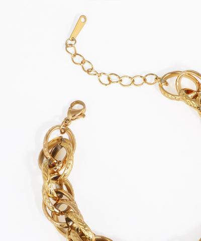 Gold bracelet on a white background