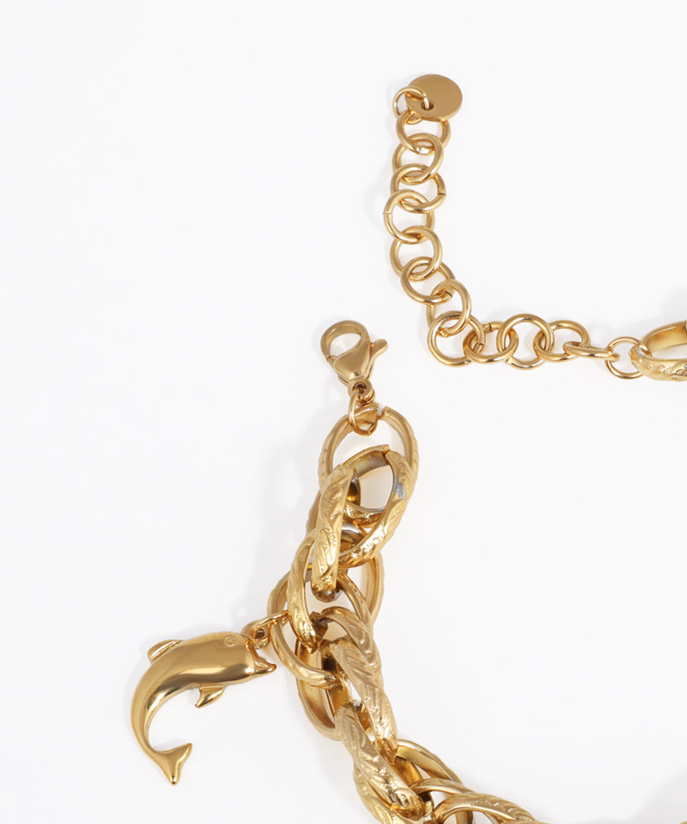 Gold chain bracelet with a unique clasp design on a white background