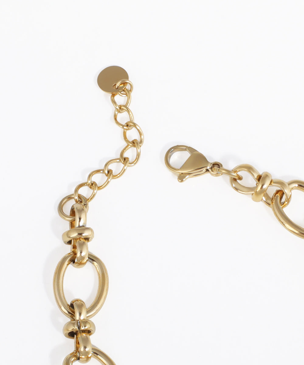 Gold bracelet with clasp on a white background