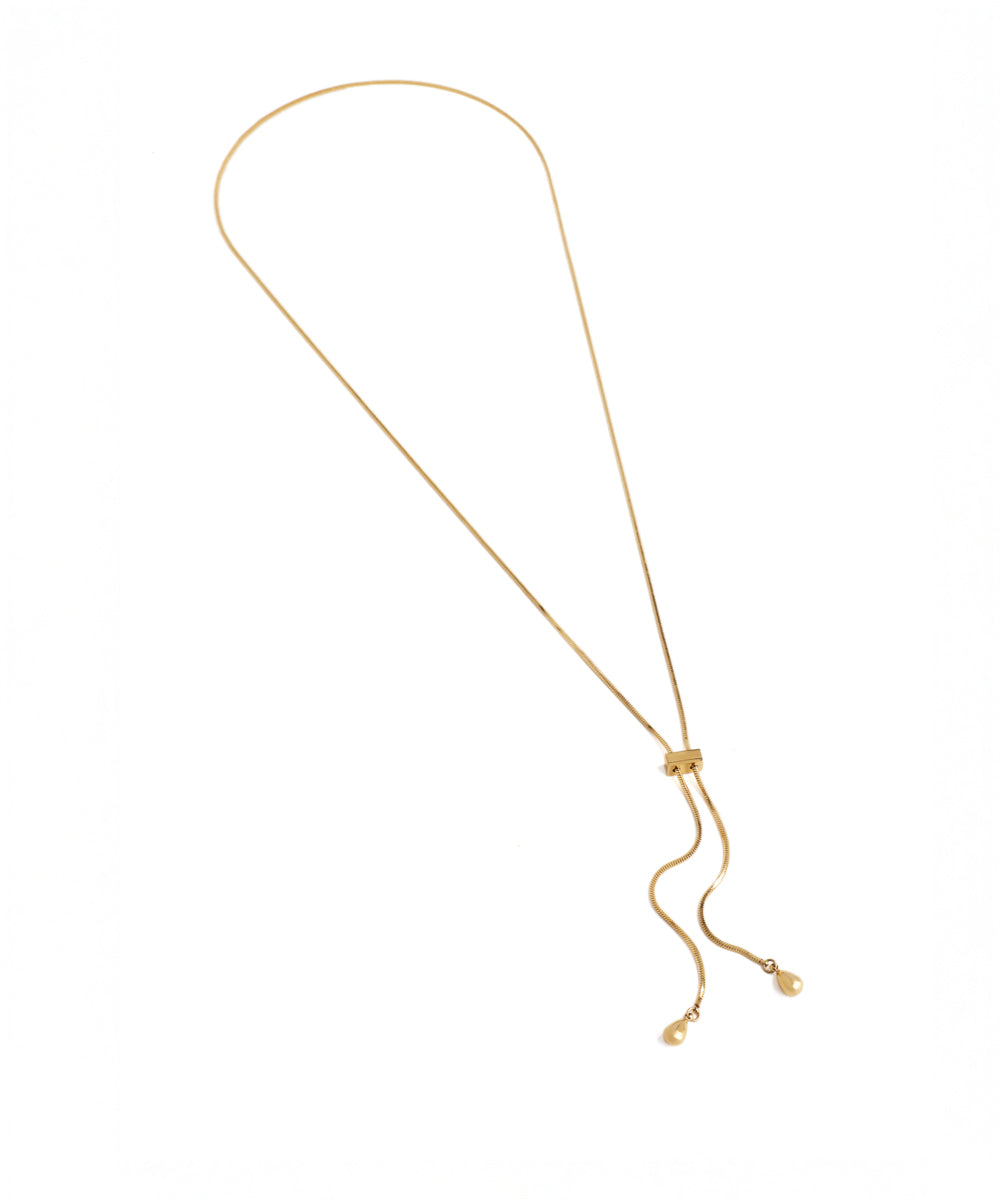 Gold necklace on a white background