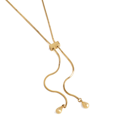 Gold necklace with a pendant on a white background