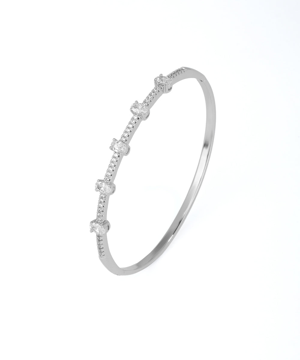 Silver bracelet with small diamonds on a white background