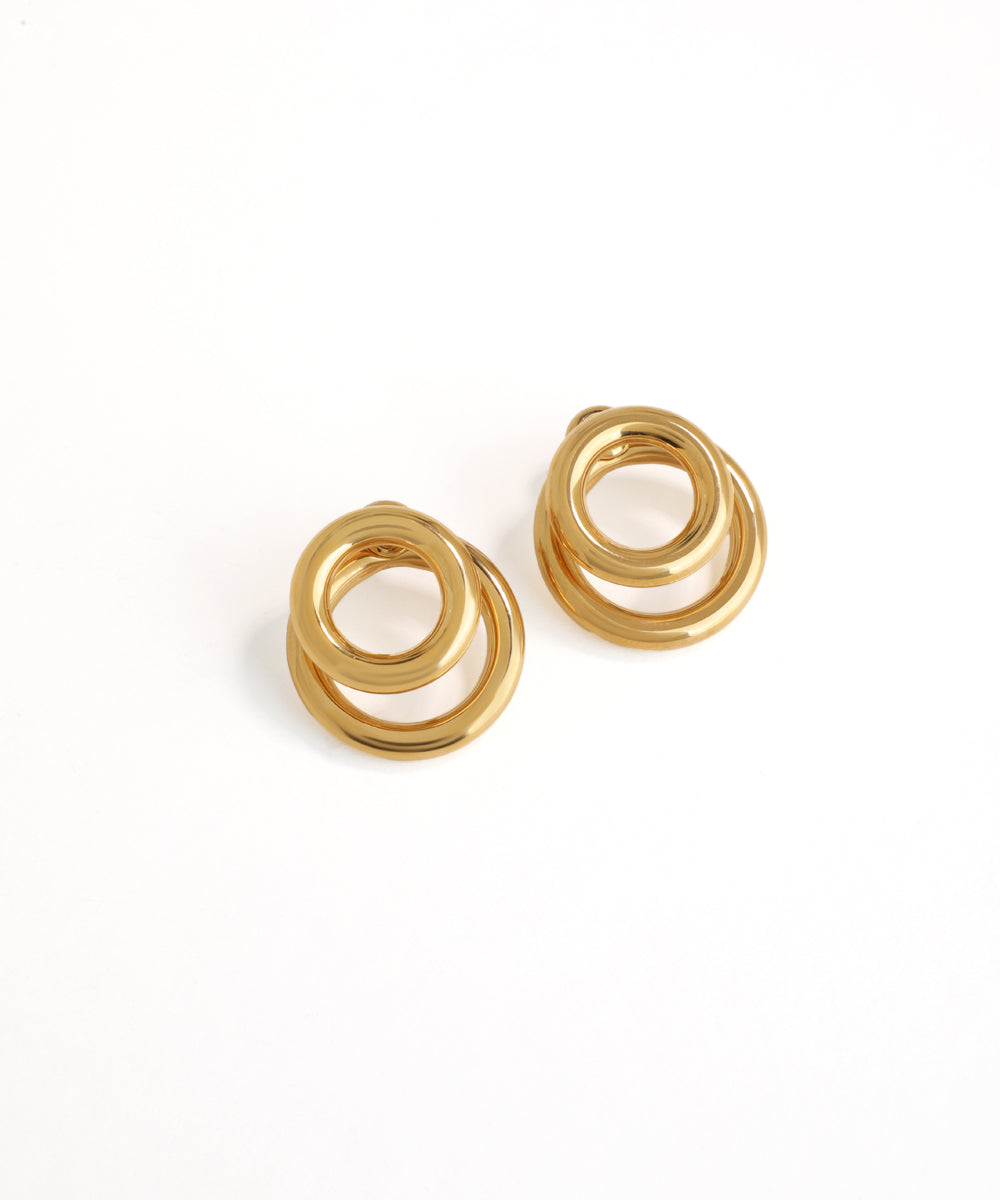 Pair of gold spiral earrings on a white background