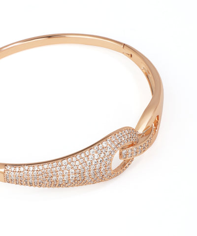 Rose gold bracelet with diamond accents on a white background