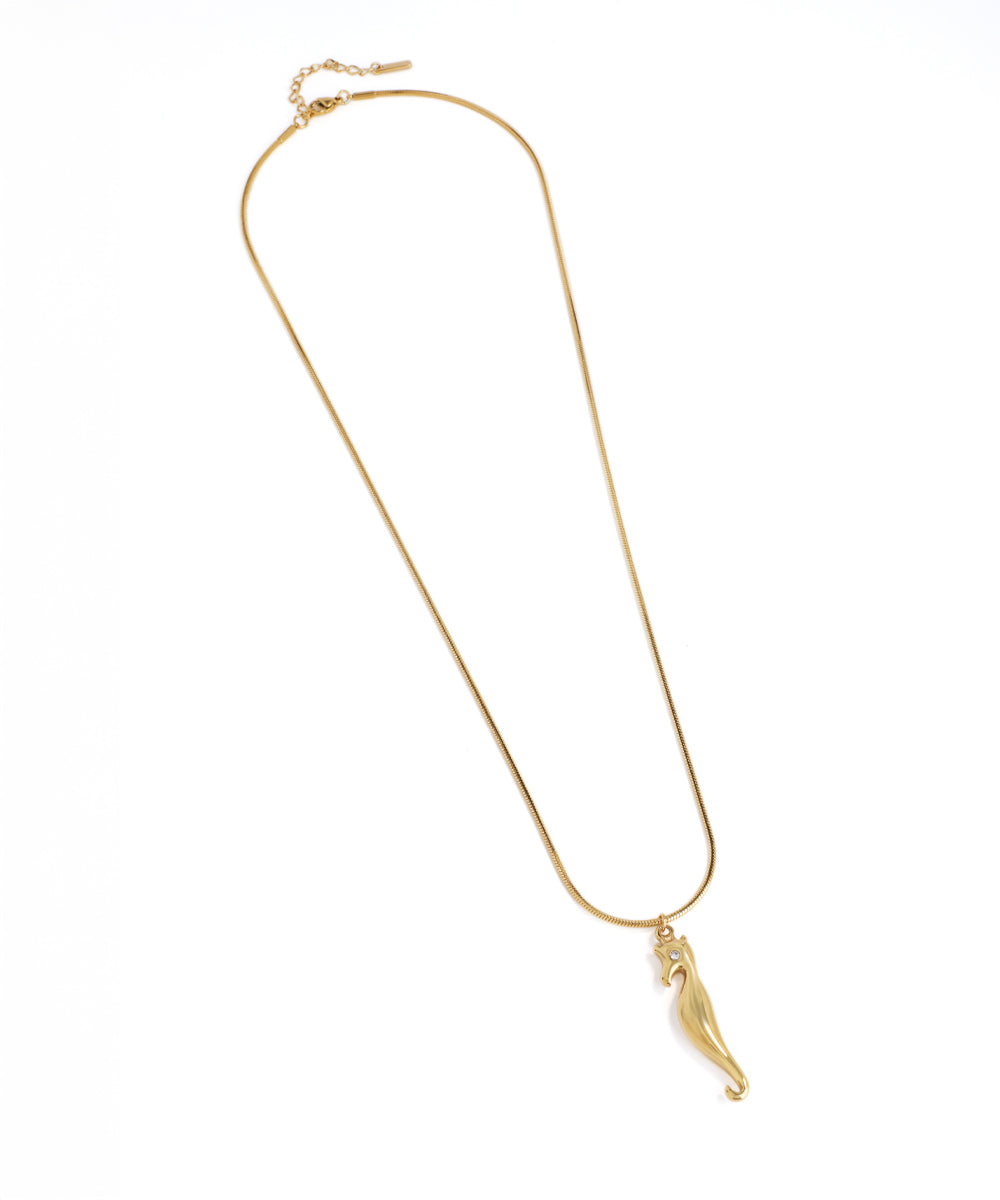 Gold necklace with a pendant on a white background