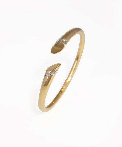 Gold bracelet with small diamonds on a white background