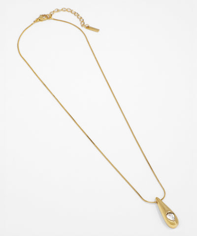 Gold necklace with a unique clasp on a white background