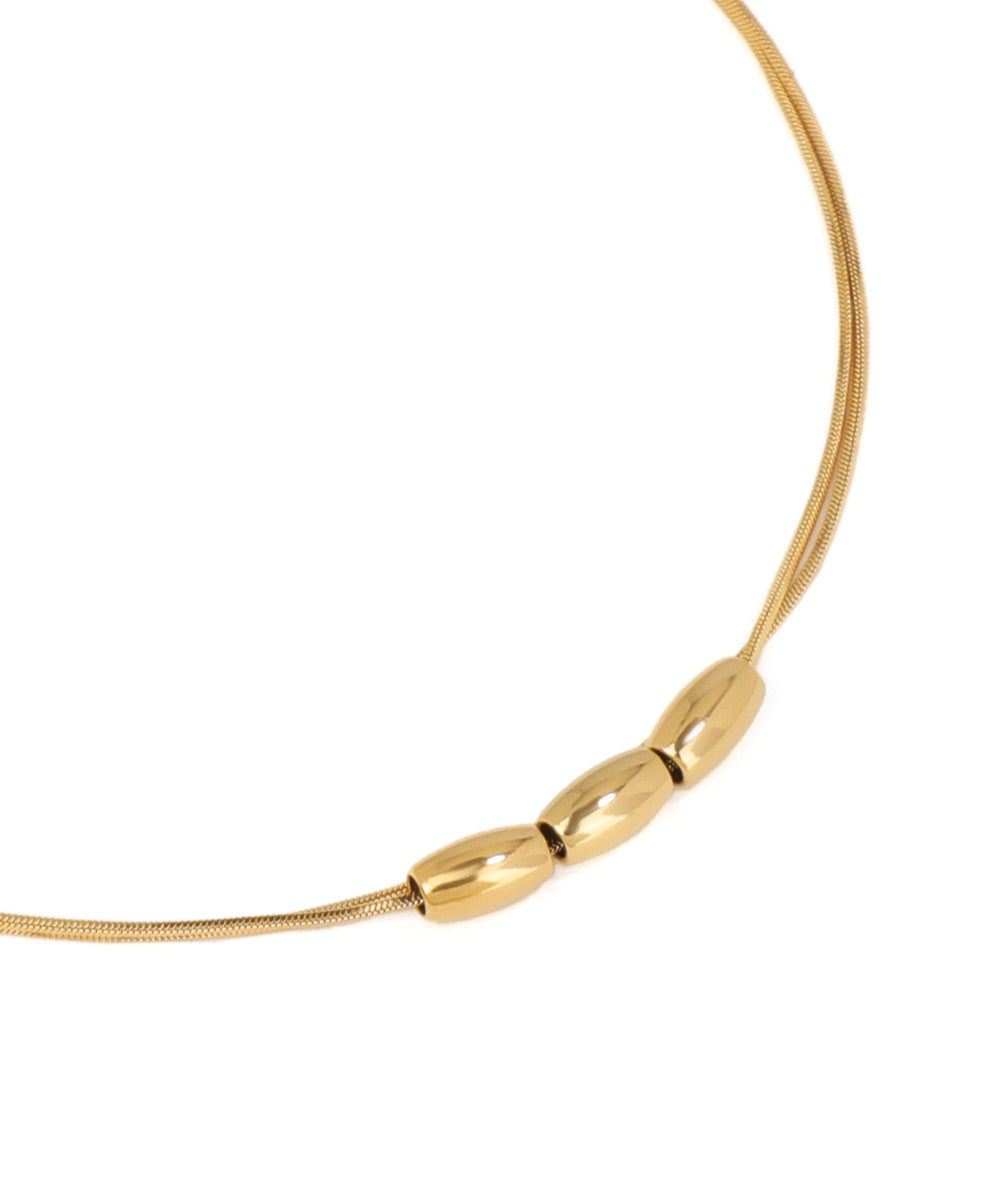 Gold necklace with a clasp on a white background