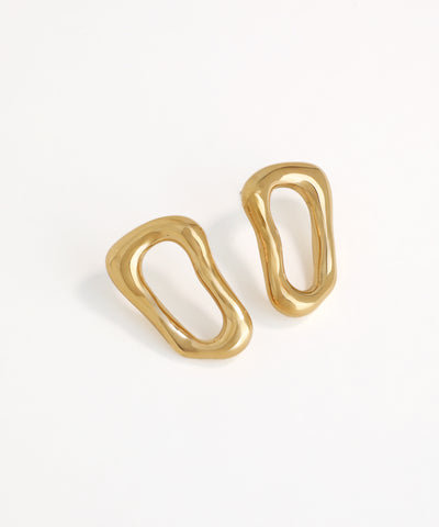Pair of gold earrings on a white background modern 