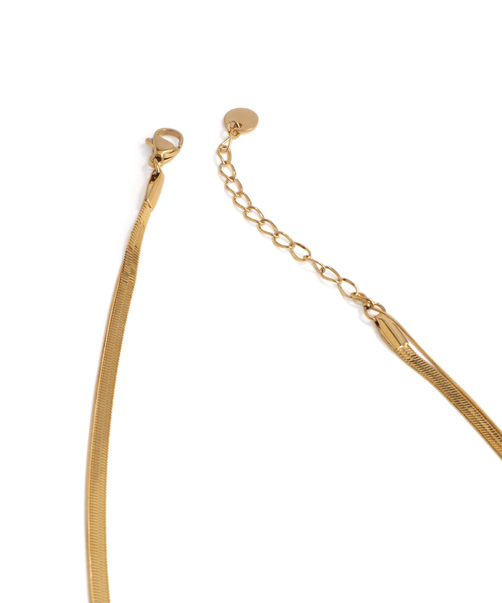 Gold necklace on a white background